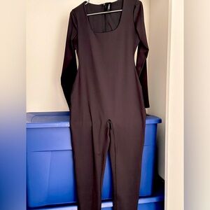 Woman skims jumpsuit size large
